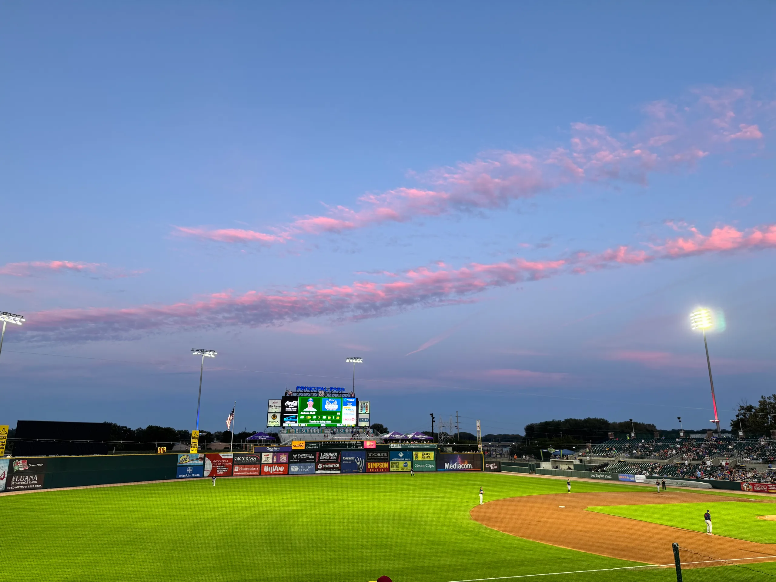 Iowa baseball under pink evening clouds